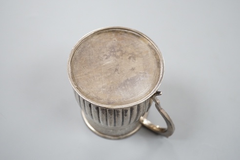 A George IV demi-fluted silver christening mug, with later engraved inscription, London, 1823, 69mm.